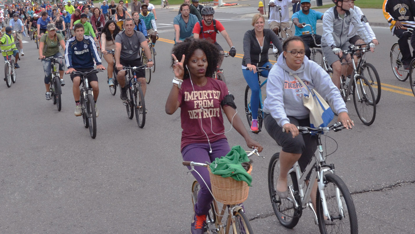 Students riding their bikes during Detroit's Slow Roll